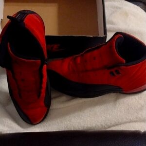 Red and black Nike air Jordans with Micheal Jordan number 23